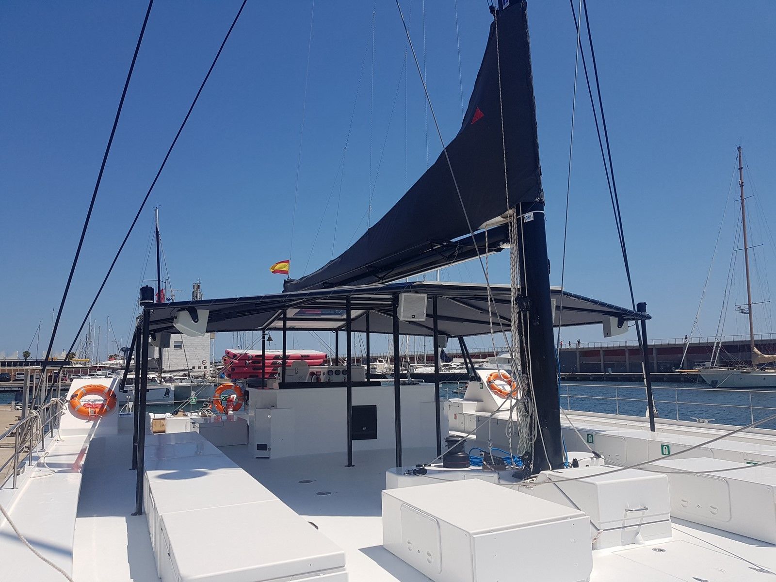 A small private event space in a modern catamaran with coastal views.jpg