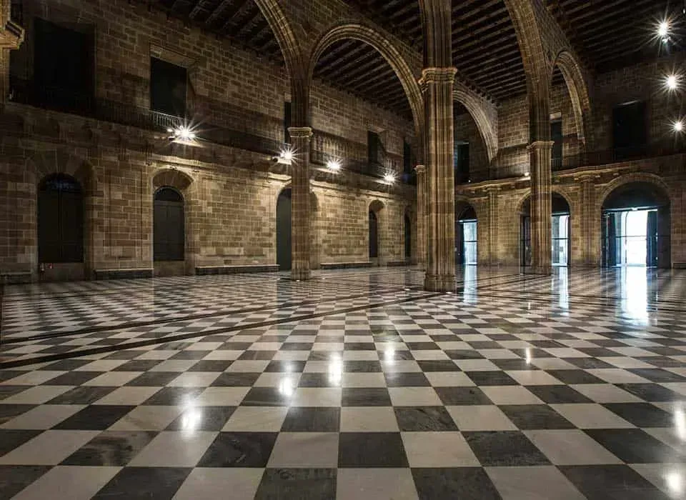 Grand Gothic-inspired venue in Barcelona with magnificent arches and stunning carved columns.webp