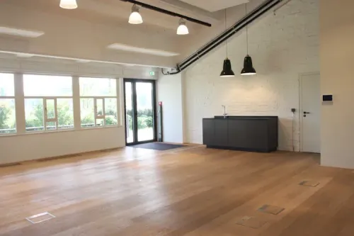 Industrial-Modern Hall With Garden Access for Large Corporate Events