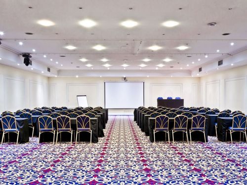 Expansive Meeting Hall With Patterned Flooring for Conferences