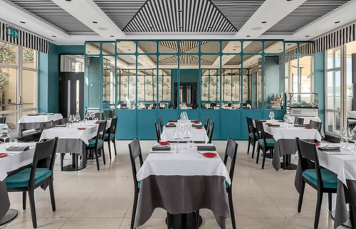 Striped-Ceiling Salon Framed by Scenic Murals for Corporate Dinners and Brand Launches.