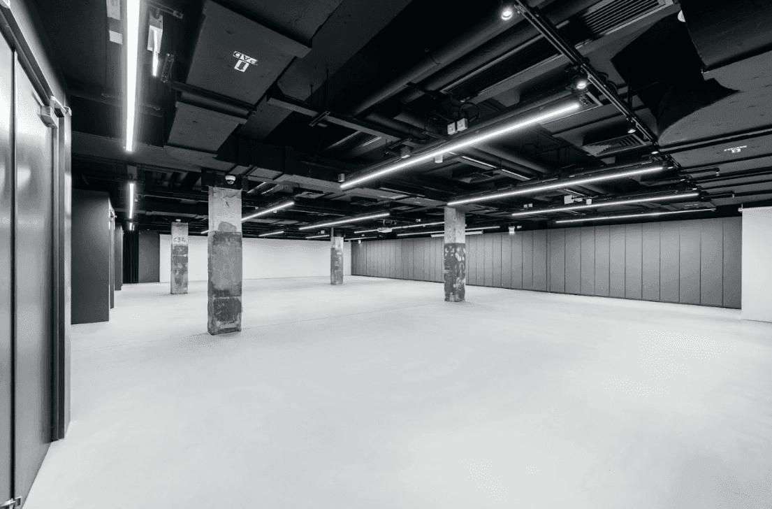 Modern monochrome event space with industrial and cutting-edge design.png