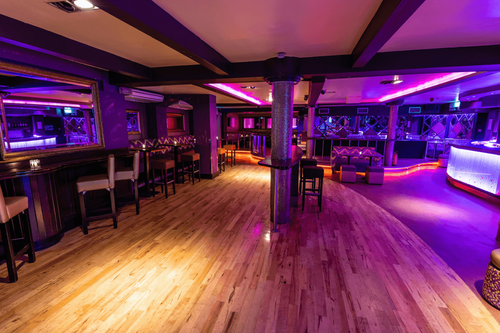 Vibrant Art Deco Club With Neon Lighting for Energetic Corporate Mixers