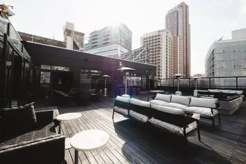 Urban Rooftop Terrace With Greenery and Skyline Views for Networking Mixers