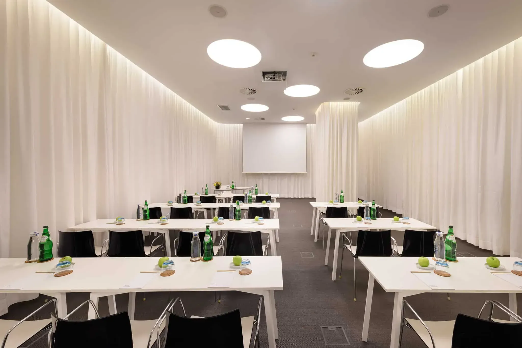 A minimalistic sustainable venue with eco-friendly features.webp