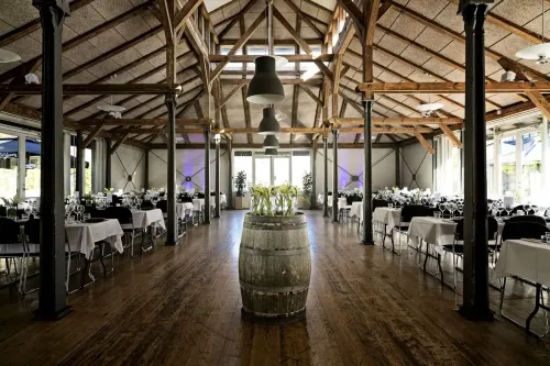 Contemporary Rustic Restaurant With Exposed Trusses and Courtyard Terrace for Networking Events