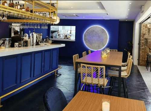 Modern Eco-Chic Bar With Bold Blue Accents Perfect for Creative Workshops