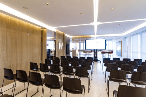 Gold-Draped Refined Venue With City Views for Executive Conferences