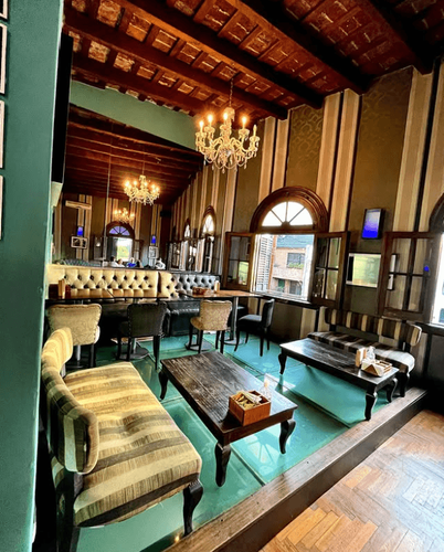 Neoclassical High-Ceiling Lounge With Rooftop Access