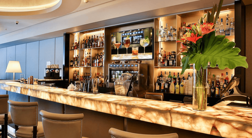 Marble-Accented Cocktail Lounge With Sculpted Ceiling for Networking Events
