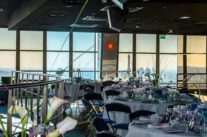 A glass-walled dinner venue in Paris with phenomenal Eiffel Tower views.webp