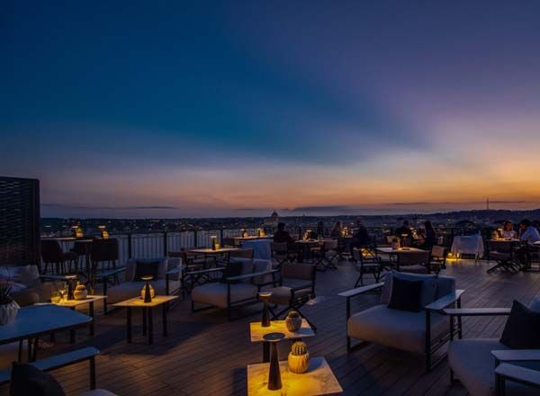 A sleek rooftop event space with a retractable awning.jpg