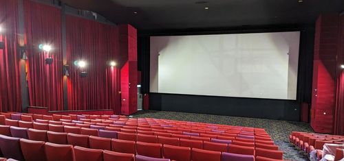 Dynamic Conference Hall with Red Upholstered Seats