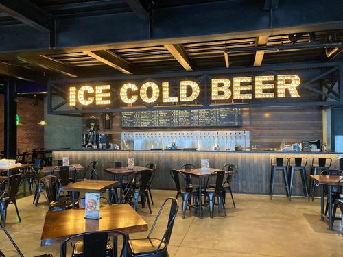 Industrial-Chic Gastropub With Vibrant Murals for After-Work Gatherings