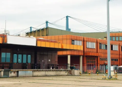 Brutalist Hangar-Style Club With Terrace Access for Immersive Art and Cultural Events
