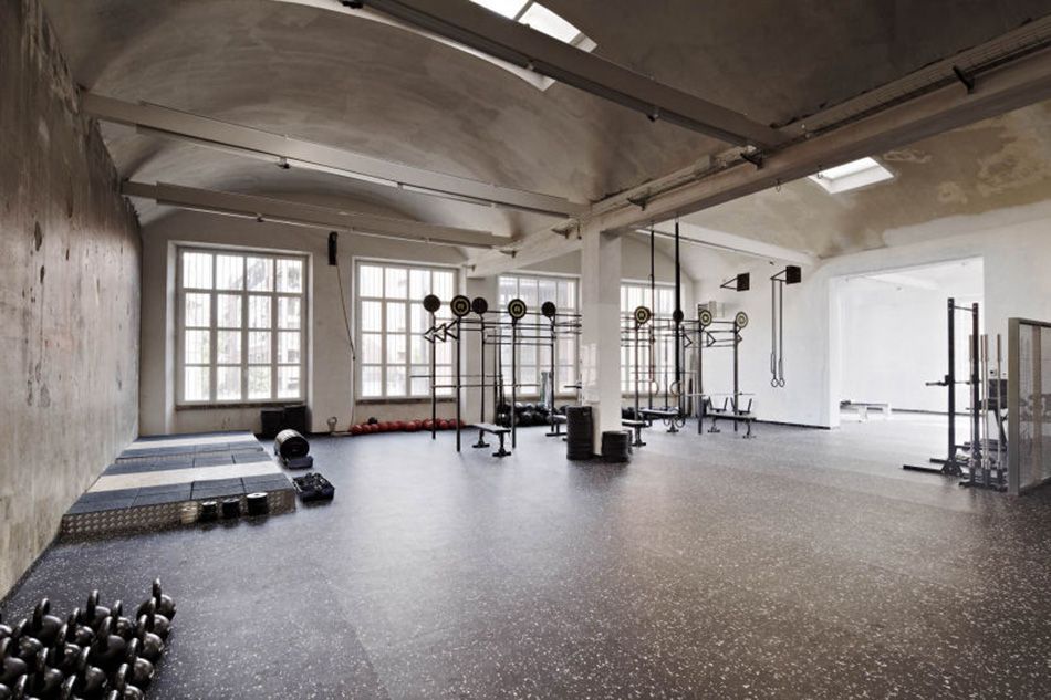 An alternative venue in an industrial-chic gym with exposed brick and skylights.jpg