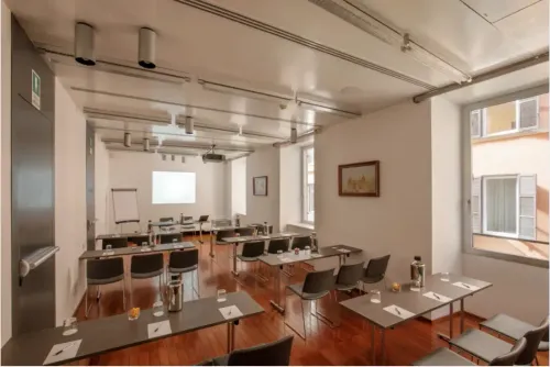 Track-Lit Meeting Room With Natural Light for Corporate Meetings