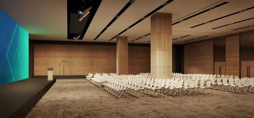 Sleek Conference Hall With Full-Width LED Screen and Luxe Timber Finishes for High-Impact Talks