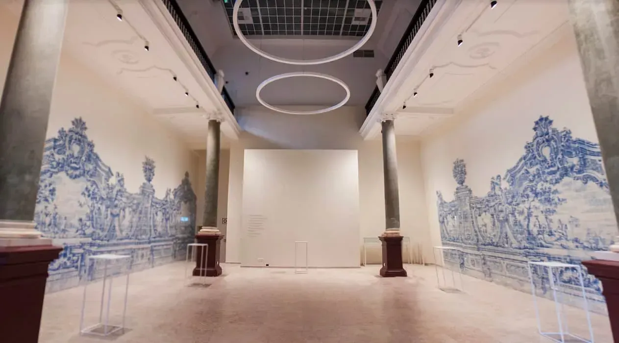 An elegant neoclassical exhibition location with Azulejos murals.webp