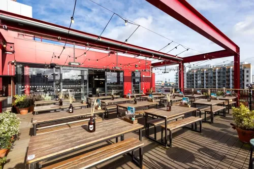 Outdoor Terrace With Industrial Facade for Relaxed Gatherings