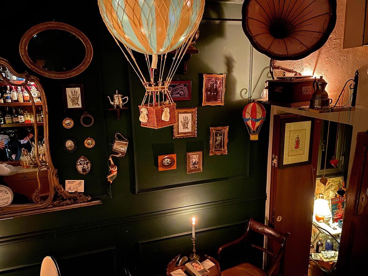 A small private event space in a Belle Époque speakeasy with antique furnishings.jpg