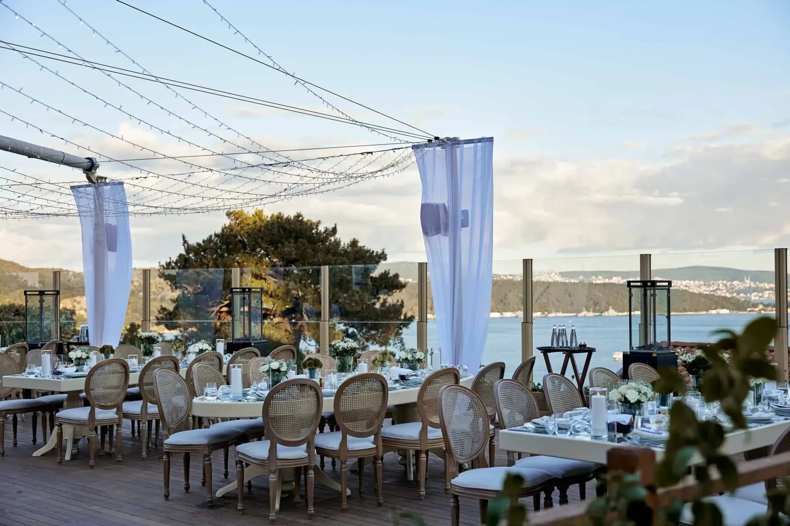 An elegant waterfront terrace in Istanbul with rustic charm.webp