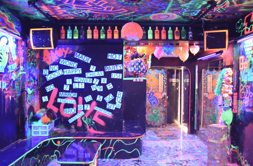 Glowing Blacklight Venue With a Rooftop