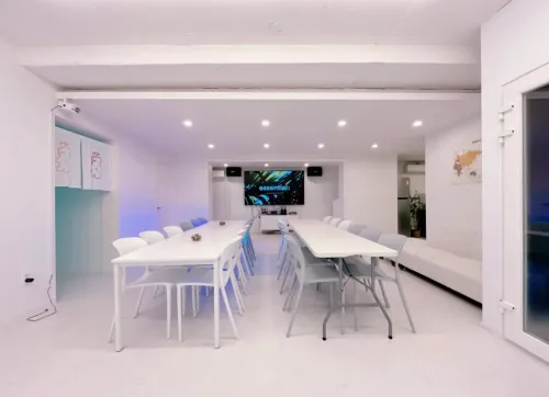 Pristine White Studio With Led Lighting, 86” TV and Kitchen for Team Workshops