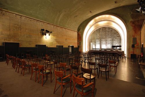 Art Deco Revival Auditorium With Dramatic Arched Stage for Iconic Performances