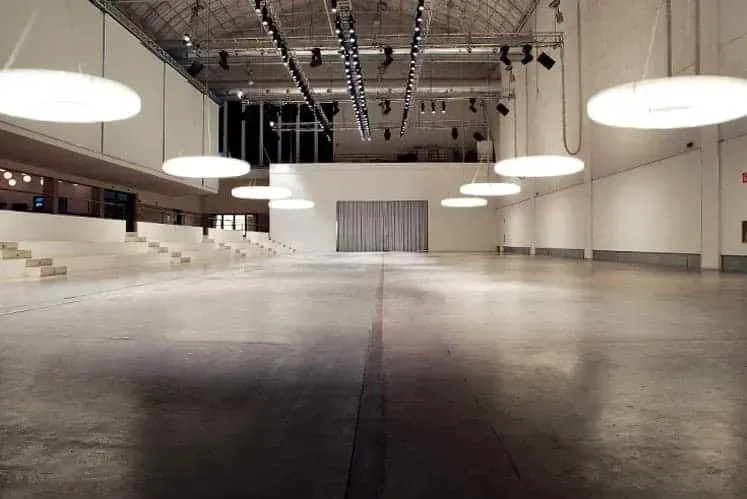 A modern blank canvas warehouse venue for hire with industrial aesthetics.webp