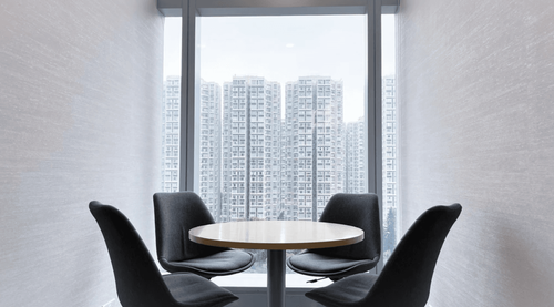 Small Meeting Space With City Skyline Views and Sleek Design for Focused Brainstorming Sessions