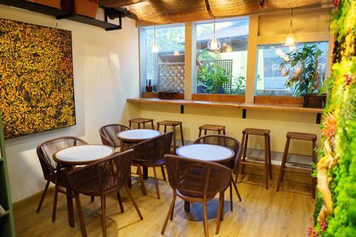 Bamboo-Clad Rustic Haven With Wicker Seating and Outdoor Patio for Intimate Gatherings