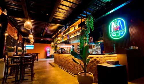 Brick-Walled Bar With Golden Eclectic Lights for Performances