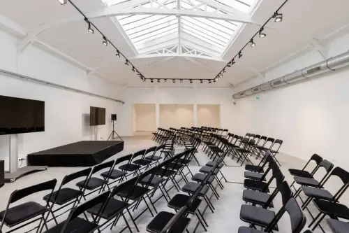 Expansive White Loft With Skylit Ceilings for Versatile Corporate Events