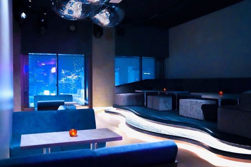 Luminous Noir Restobar With Cosmic Hues and Cityscape Views for Vibrant Soirées