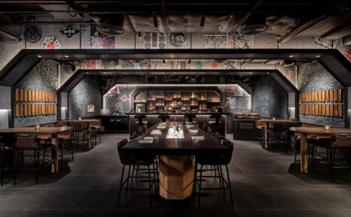 Urban Industrial Izakaya With Retro Poster Ceiling for After-Hours Socials