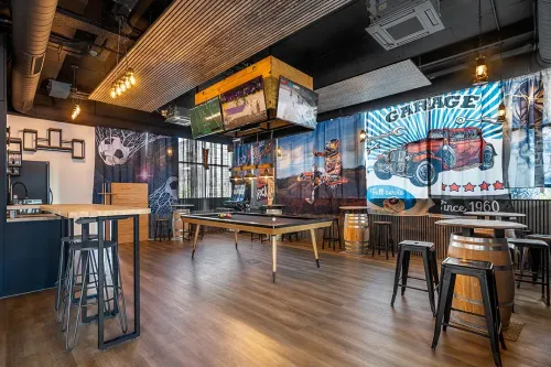 Retro Sports Lounge With Bold Decor for Lively Team-Building Events