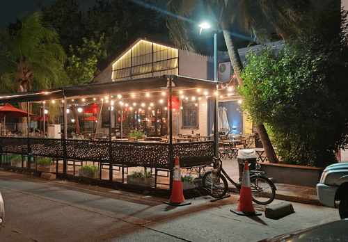 Indoor and Outdoor Corporate Event Space With Lush Greenery and Industrial Charm