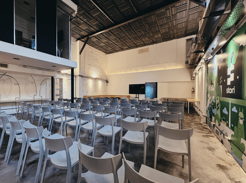 Loft-Style Hall With Mural Artwork for Workshops & Presentations