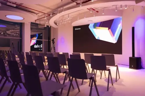 Futuristic Venue With Curved Ceilings and Soft Furnishings for Immersive Workshops