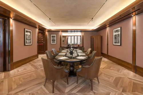 Walnut-Panelled Boardroom With Chevron Parquet and Private Lounge for C-Suite Strategy Sessions