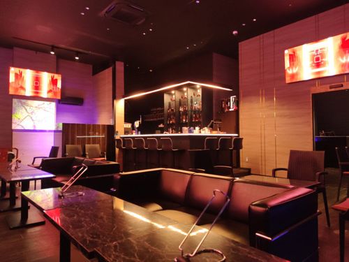 Opulent VIP Lounge With Textured Walls and Leather Seating for Exclusive Celebrations