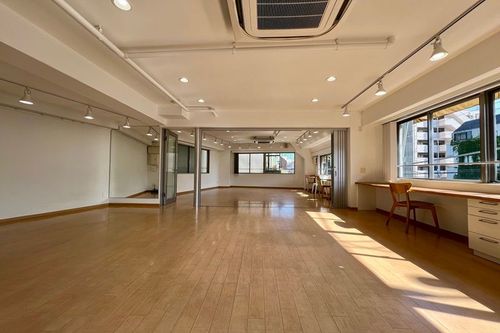 Radiant Minimalist Studio With Sleek Wood Floors for Wellness and Workshops