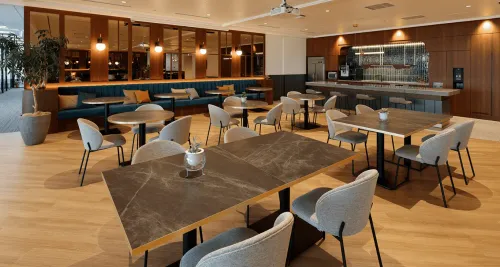 Modern Corporate Lounge With Retro Flair and City Views for Business Gatherings