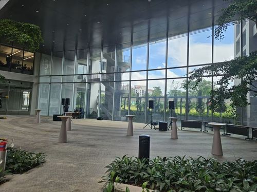 Sunlit Garden Atrium With Expansive Glass Windows for Launches and Live Acts