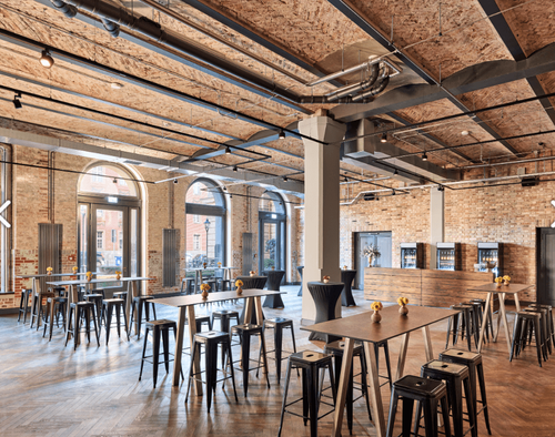 Exposed-Brick Hall With Vaulted & Arched Windows for Receptions