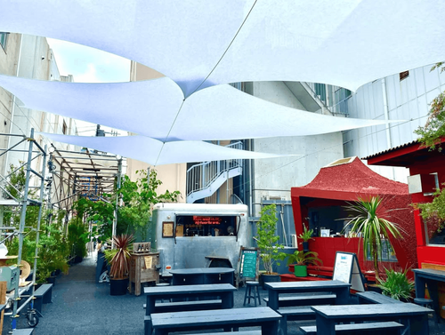 Urban Oasis With Geodesic Domes and Bold Red Accents for Creative Events