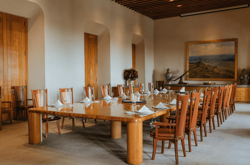Timber-Lined Dining Room With Historic Artwork