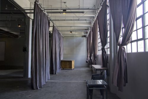 Sound-Treated Industrial Hall With Blackout Drapes for Immersive Brand Moments