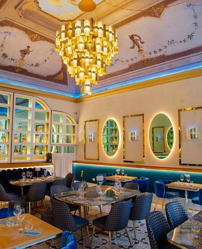 Elegant Dining Room with Gold Accents and Frescoed Ceilings for Special Events